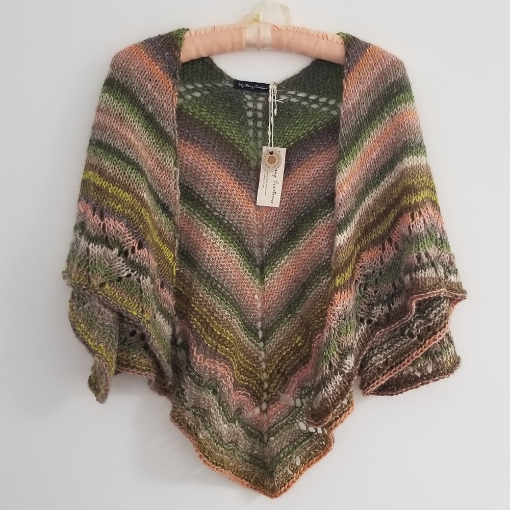 Hand knitted triangular wool blend shawl.